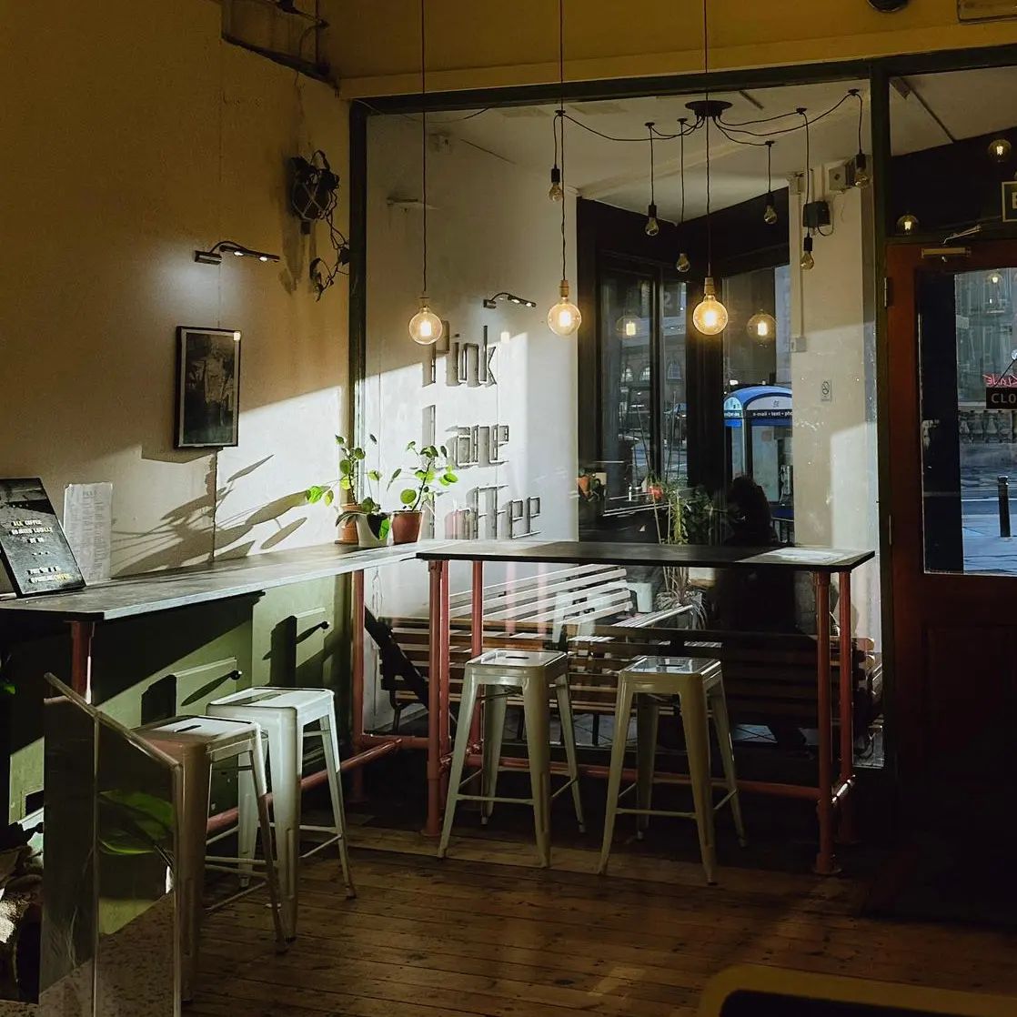 inside our Pink Lane cafe, looking out towards the bar seating and window